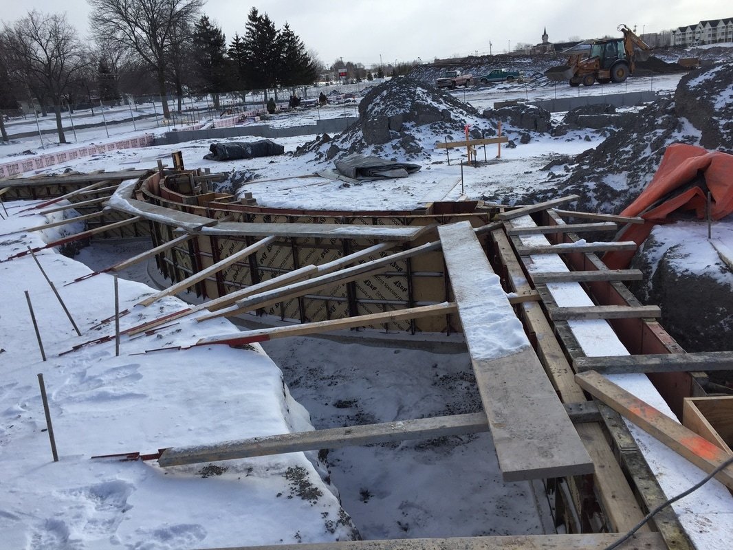 Radius wall forms set for a cold-weather pour in the snow