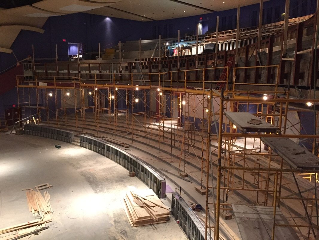 Frame shoring towers supporting elevated formwork inside a theater